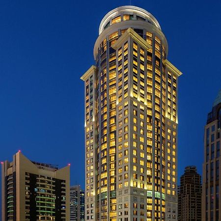 Dusit Hotel & Suites - Doha Bagian luar foto The hotel at night