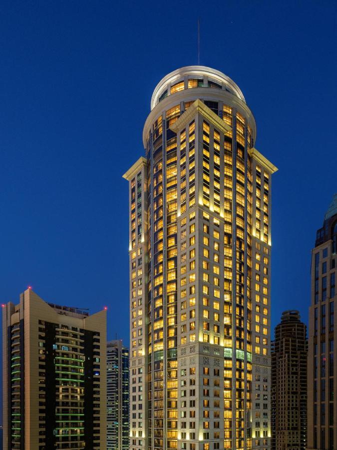 Dusit Hotel & Suites - Doha Bagian luar foto The hotel at night